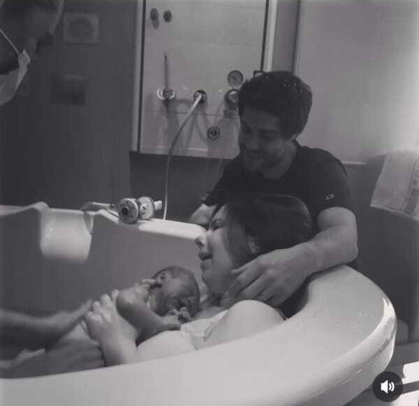 Midwife Holding Baby